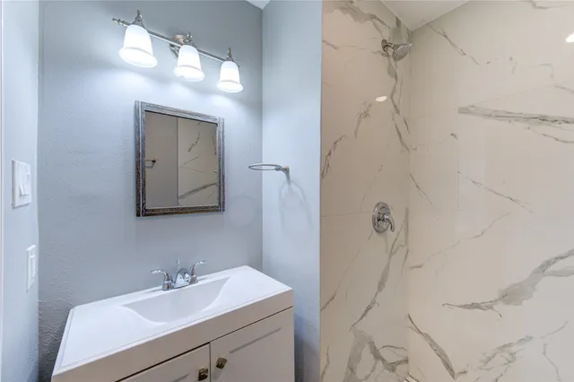 a bathroom with a sink and mirror