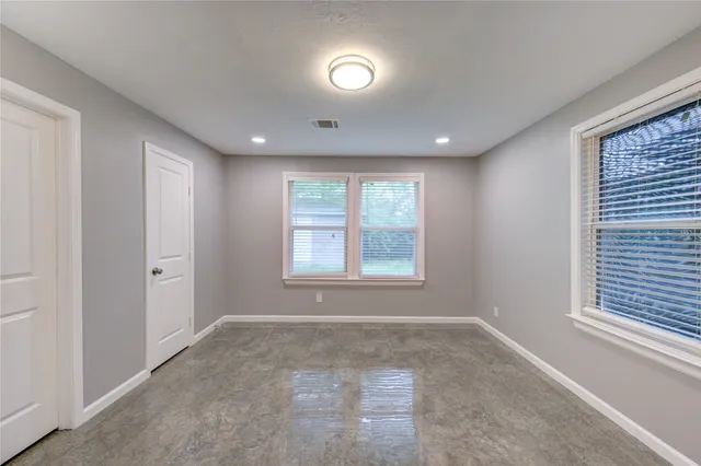 a view of a kitchen with a sink and cabinets