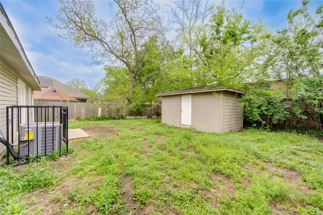 a front view of a house with yard and garage