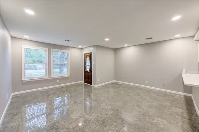 a view of an empty room with a window