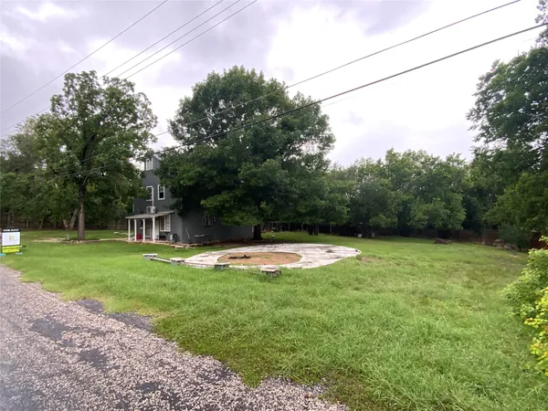 a view of a swimming pool with a yard