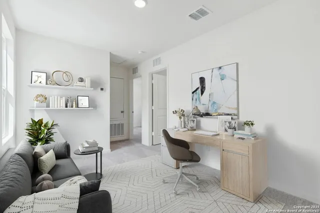 a living room with furniture and a table