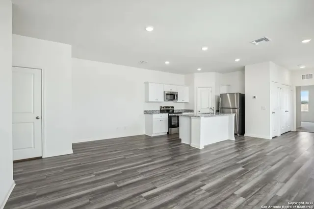 a view of kitchen with wooden floor