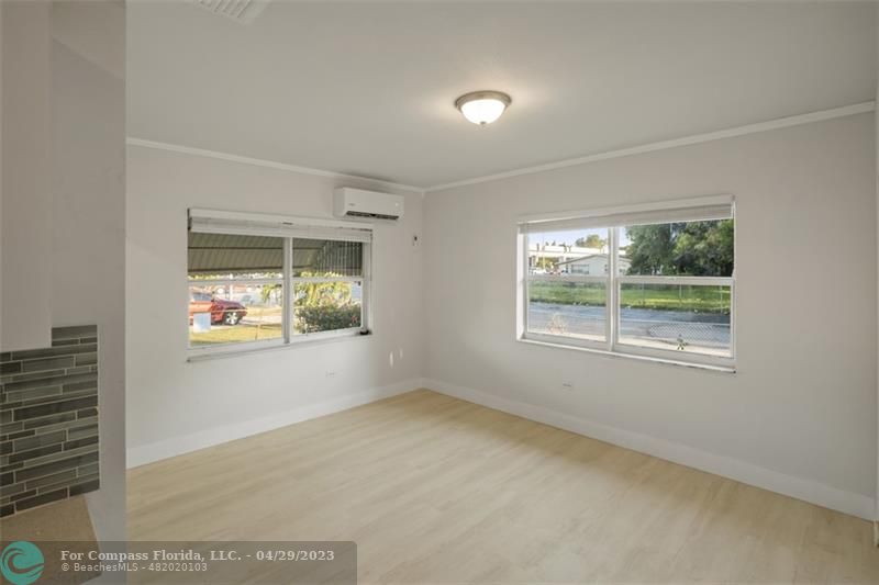 1219 Northwest 33rd Street, Unit B Miami, FL 33142 - Photo 3 of 6 an empty room with windows