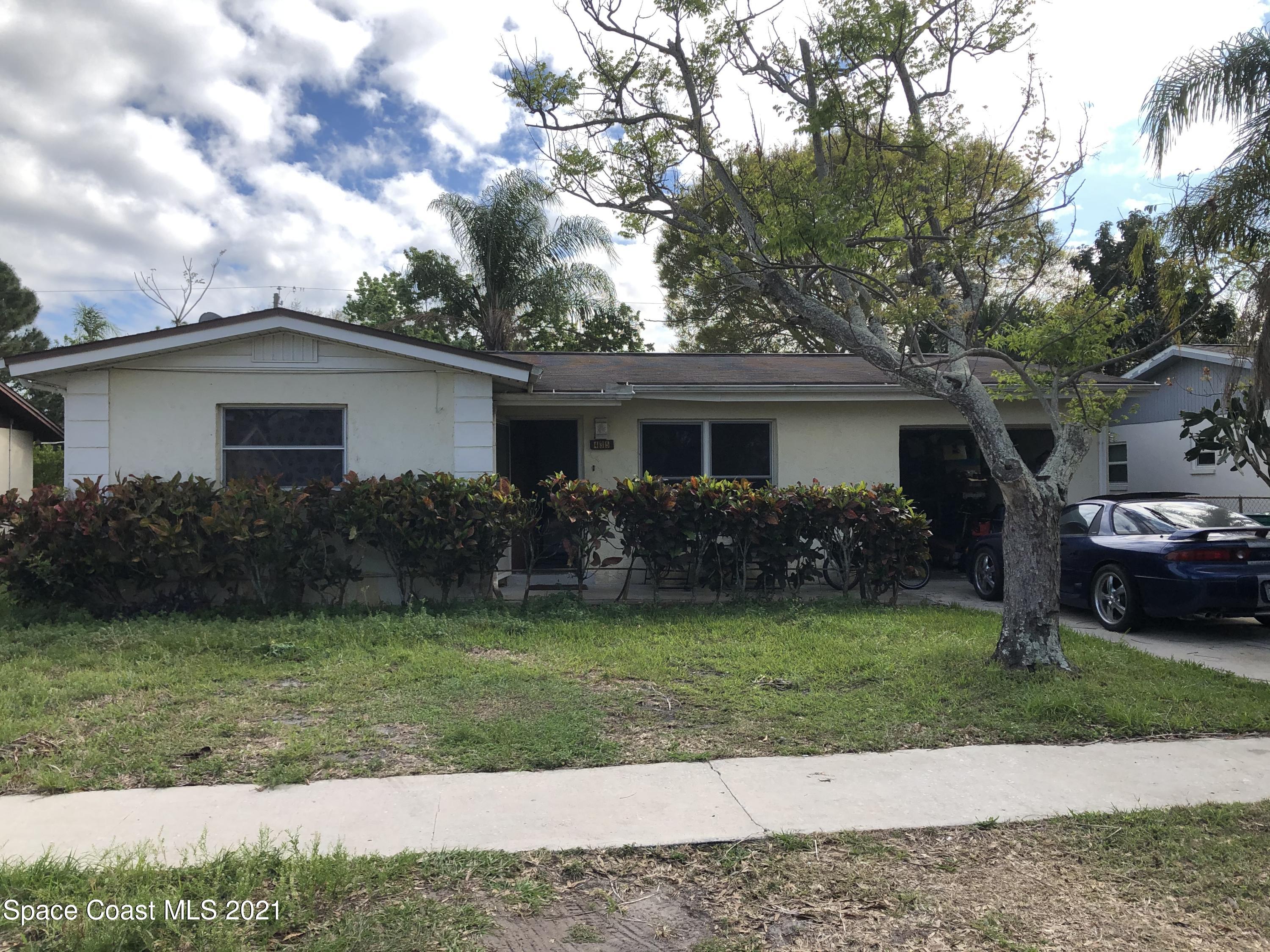 435 Count Street Melbourne, FL 32901 - Photo 1 of 7 a front view of a house with a garden