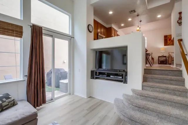 a view of a living room and entry way