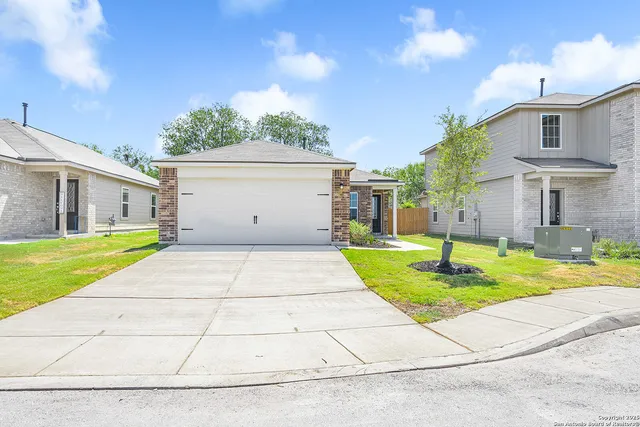 a house view with swimming pool and yard