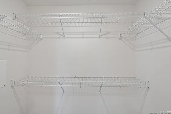 a view of a room with racks on the wall