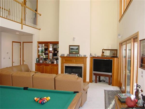 81 Edgewater Road Mashpee, MA 02649 - Photo 11 of 13 a living room with furniture a flat screen tv and a fireplace