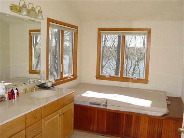 81 Edgewater Road Mashpee, MA 02649 - Photo 12 of 13 a bathroom with a sink and a window