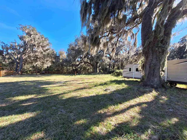 a view of swimming pool with a yard