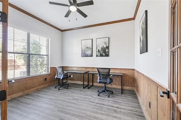 a work room with furniture and windows