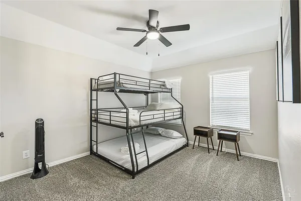a room that has a bed and a chandelier