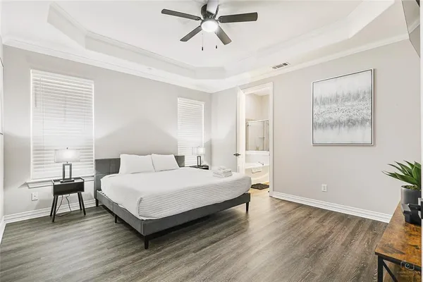 a bedroom with a bed and a table