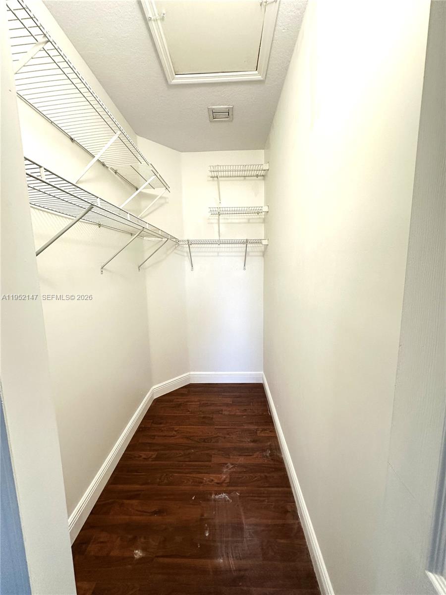 3550 Northeast 5th Street, Unit 202 Homestead, FL 33033 - Photo 19 of 23 a view of a hallway with wooden floor