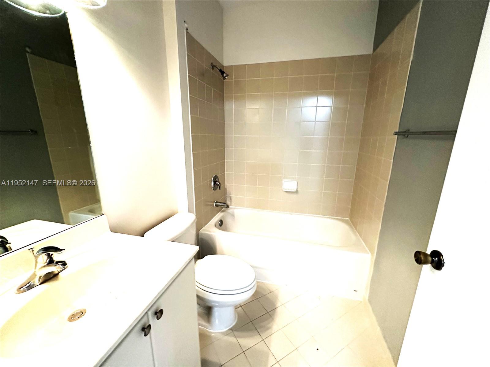 3550 Northeast 5th Street, Unit 202 Homestead, FL 33033 - Photo 22 of 23 a bathroom with a sink toilet and shower