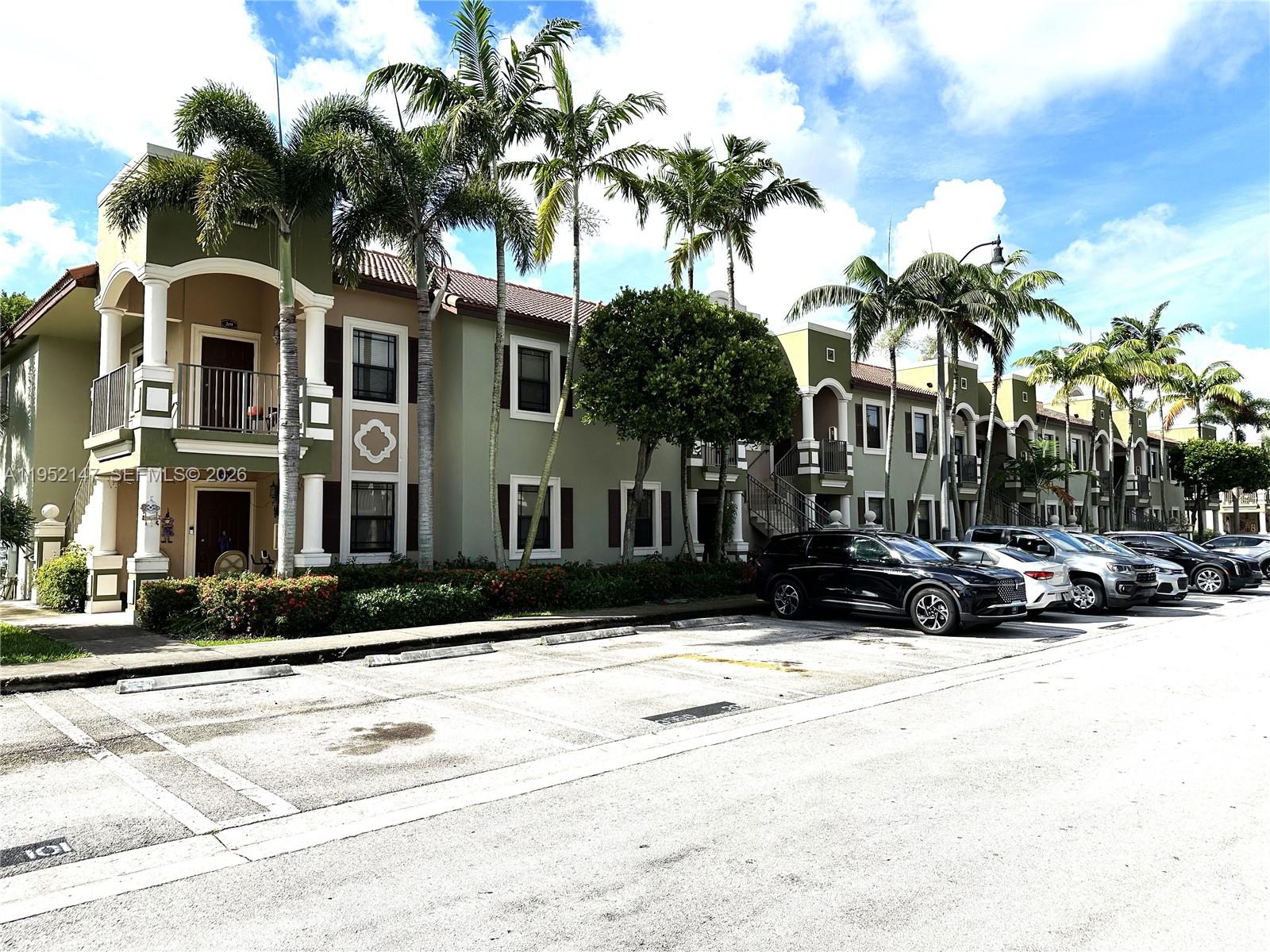 3550 Northeast 5th Street, Unit 202 Homestead, FL 33033 - Photo 3 of 23 a view of multiple houses with a yard