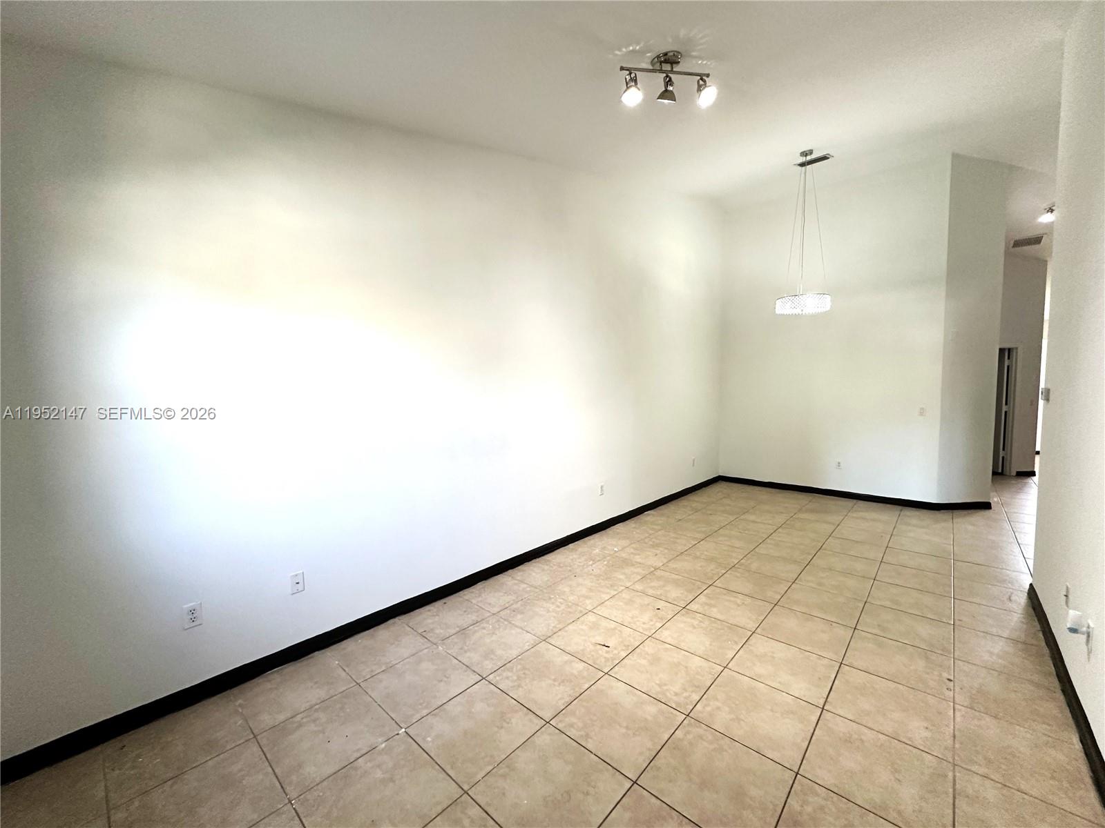 3550 Northeast 5th Street, Unit 202 Homestead, FL 33033 - Photo 4 of 23 a view of an empty room