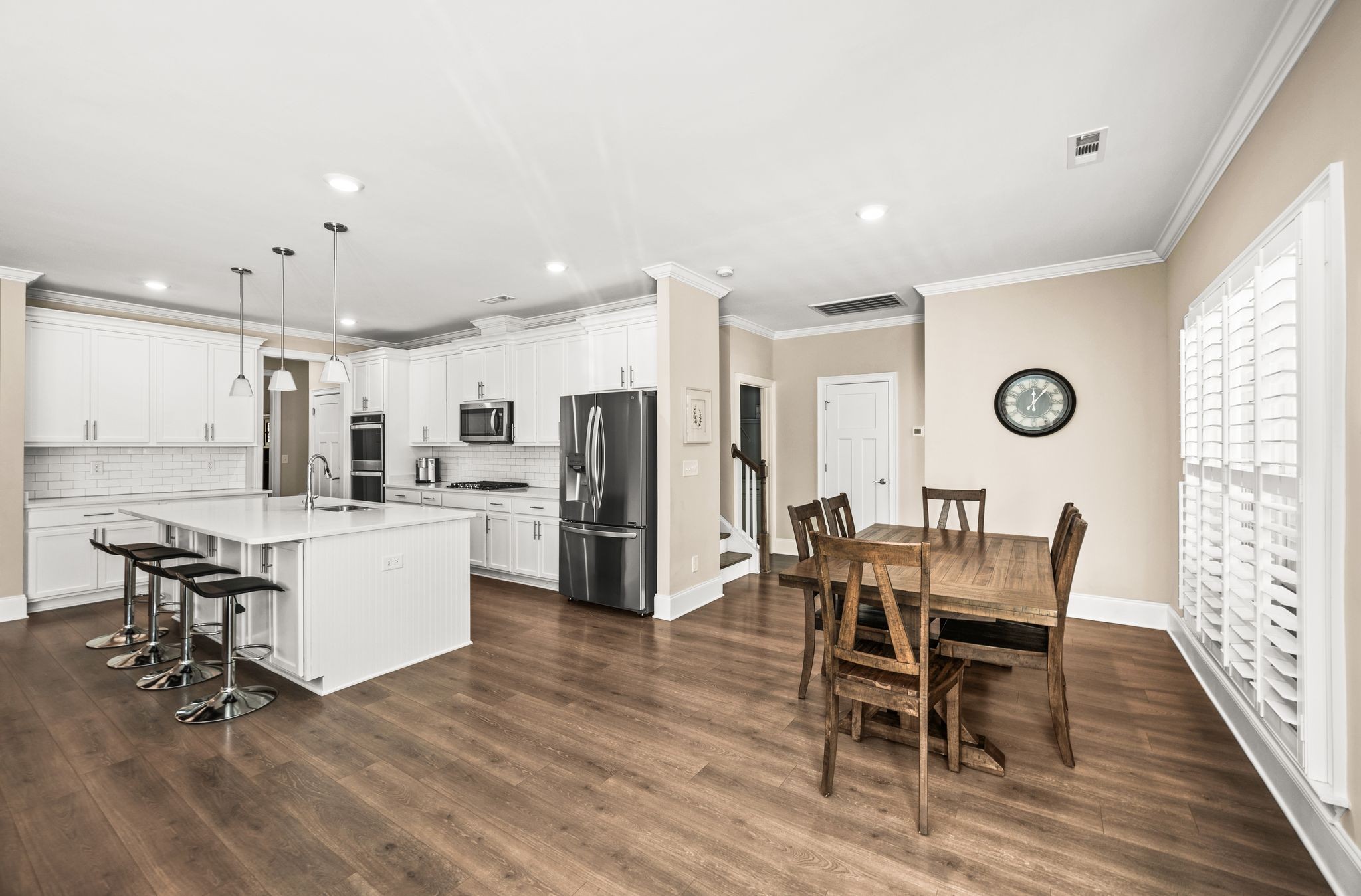 7345 Taylor Road Fairview, TN 37062 - Photo 21 of 65 a kitchen with refrigerator and chairs