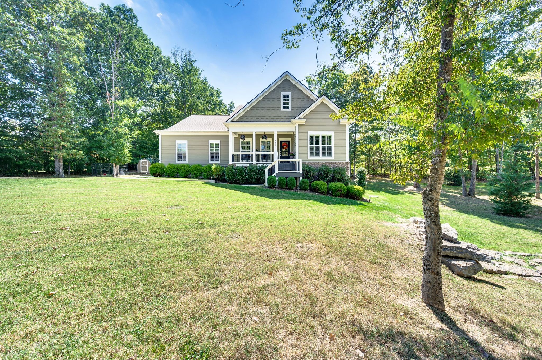 7345 Taylor Road Fairview, TN 37062 - Photo 3 of 65 a front view of a house with garden