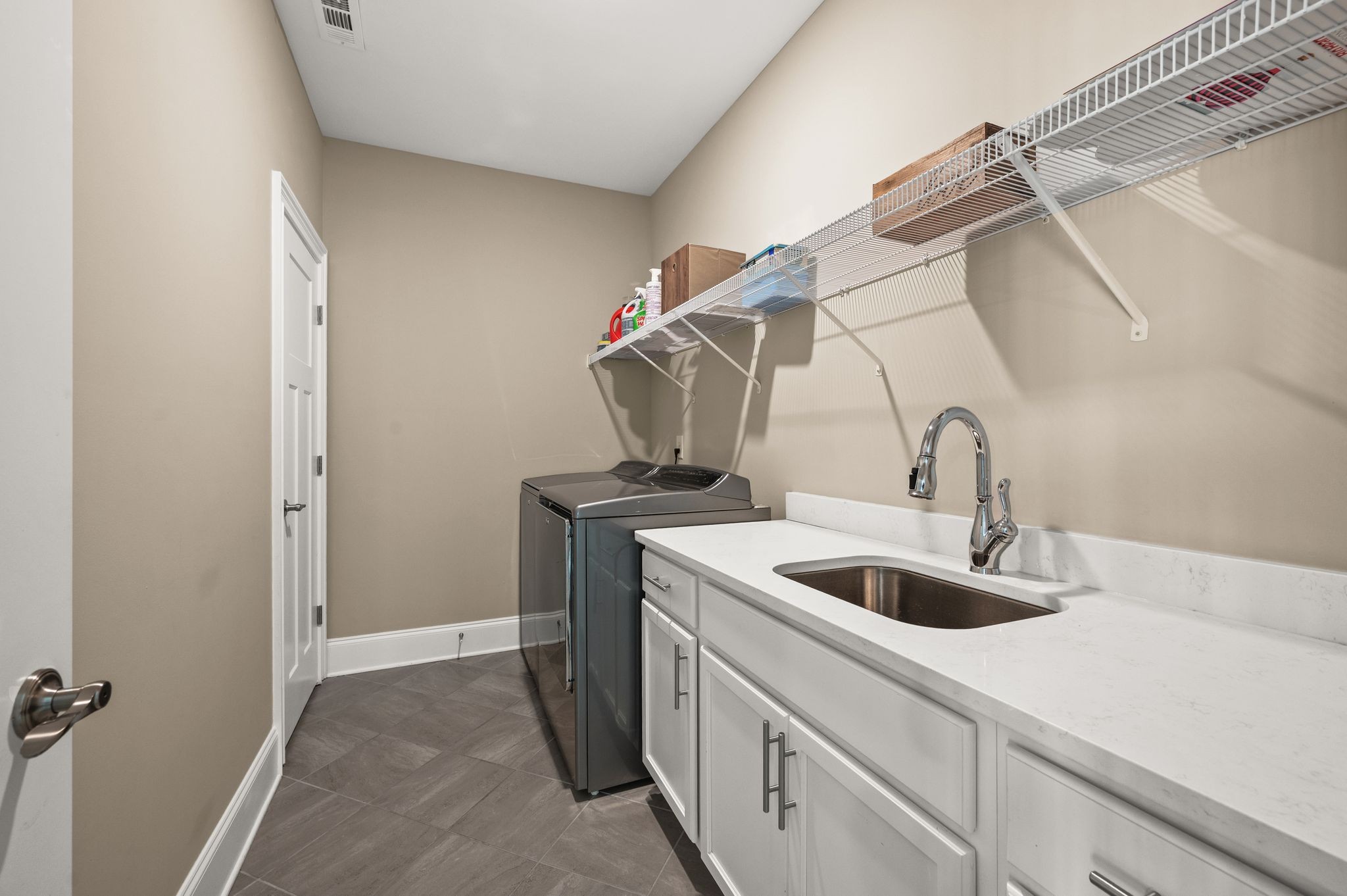 7345 Taylor Road Fairview, TN 37062 - Photo 43 of 65 a kitchen with a sink and cabinets