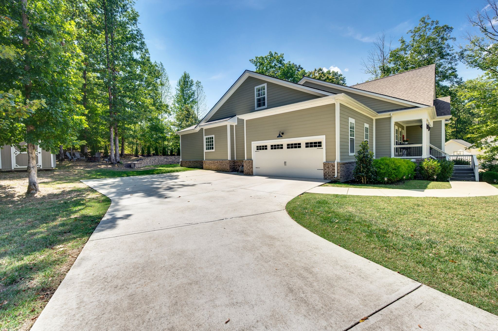 7345 Taylor Road Fairview, TN 37062 - Photo 63 of 65 a front view of a house with a yard and garage