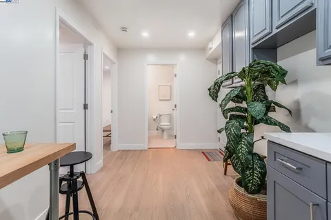 a view of a livingroom with furniture and a potted plant
