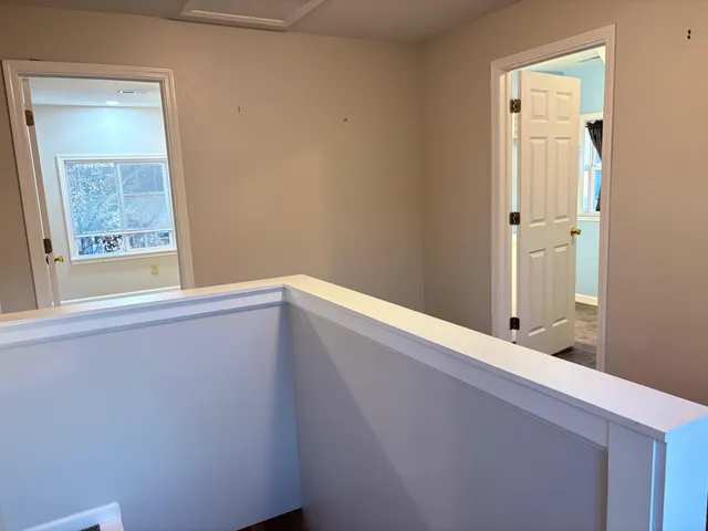 a white toilet sitting next to a shower curtain