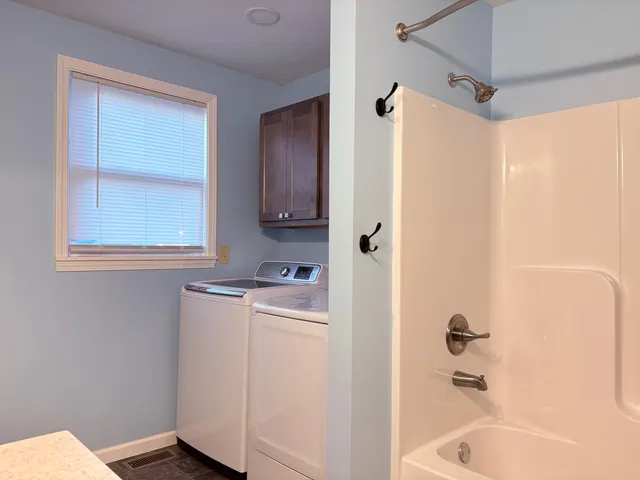 a bathroom with a bathtub sink and toilet