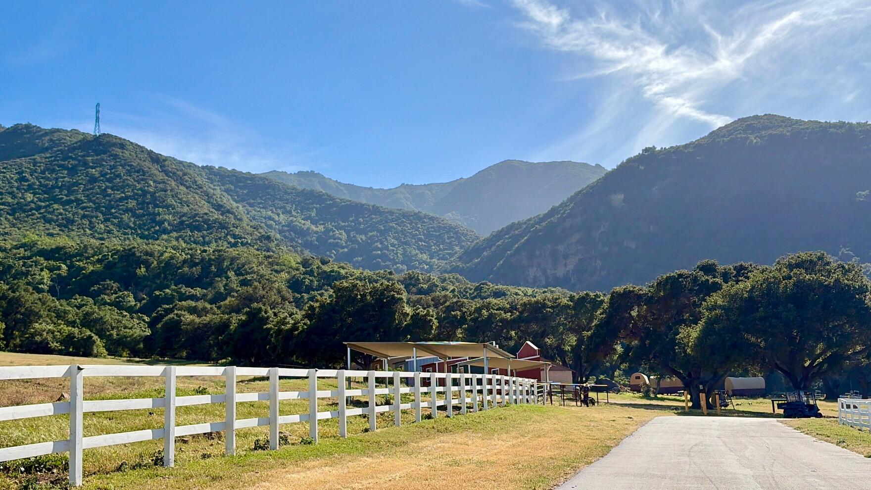 3750 Paradise Road, Unit 97 Santa Barbara, CA 93105 - Photo 1 of 17 a view of a house with a yard and a large tree