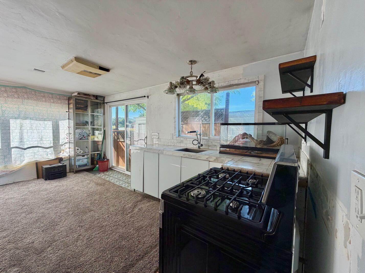 3750 Paradise Road, Unit 97 Santa Barbara, CA 93105 - Photo 3 of 17 a kitchen with a stove and a refrigerator