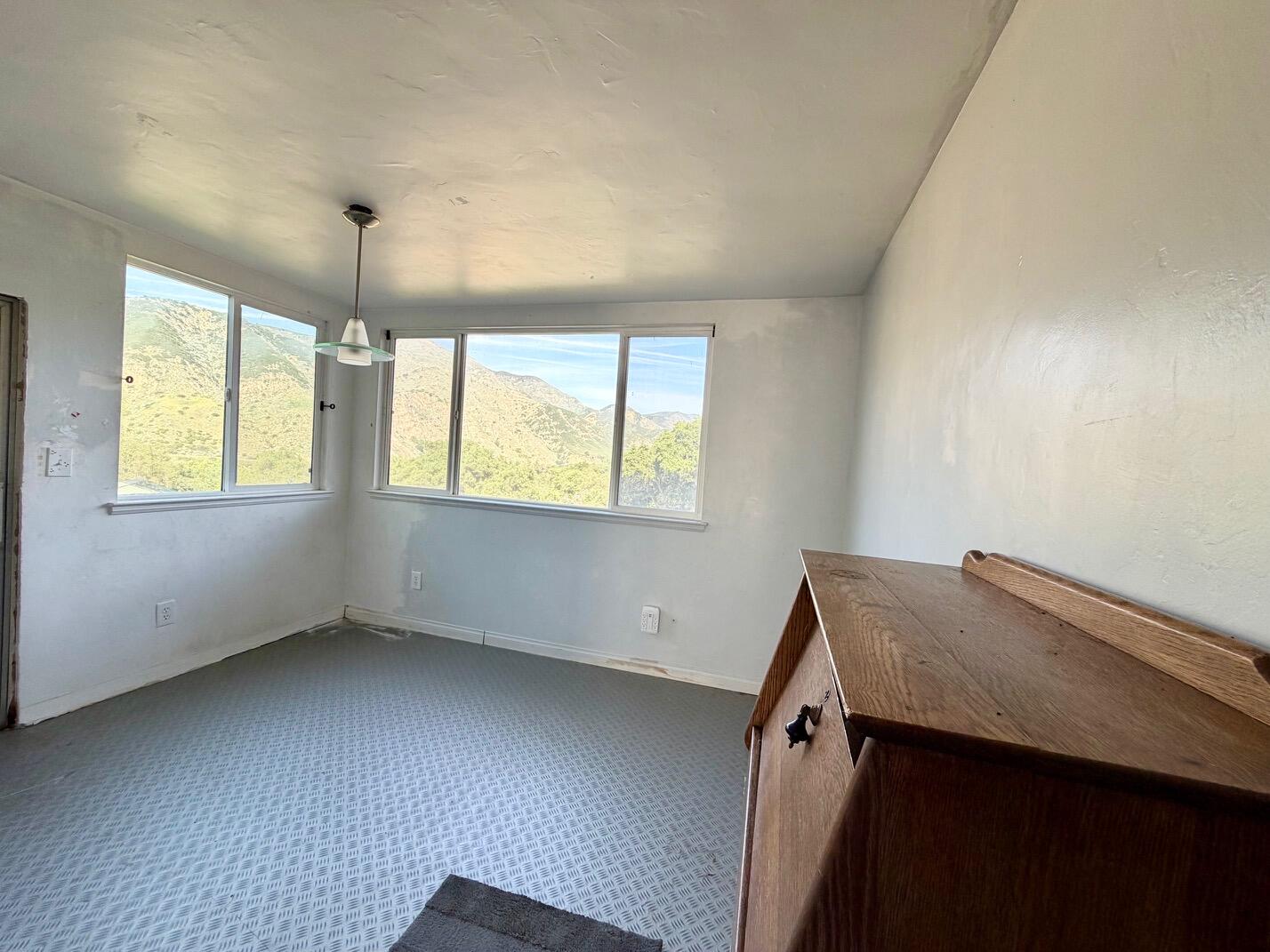 3750 Paradise Road, Unit 97 Santa Barbara, CA 93105 - Photo 4 of 17 an empty room with windows