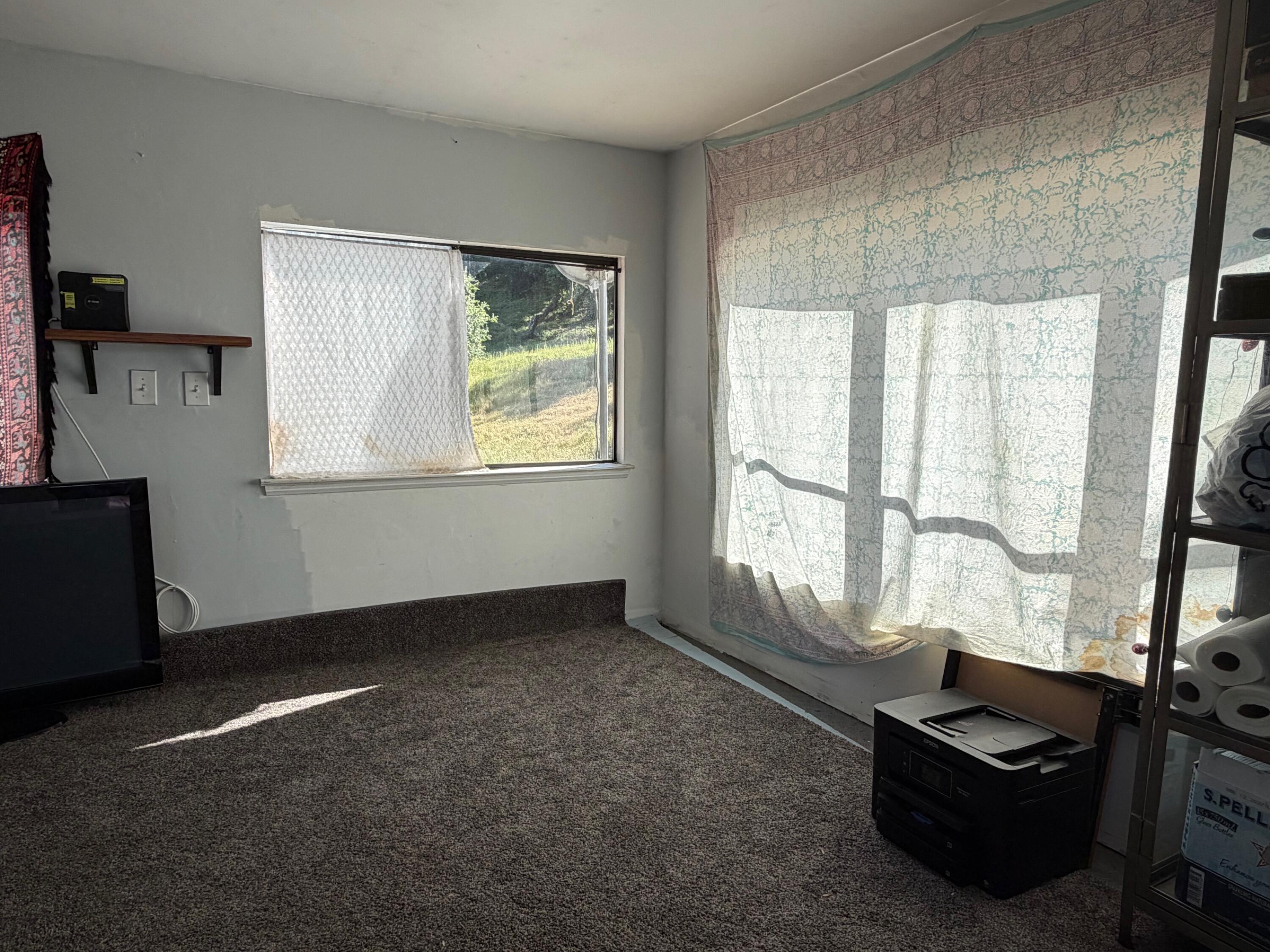 3750 Paradise Road, Unit 97 Santa Barbara, CA 93105 - Photo 6 of 17 a room with furniture and a window