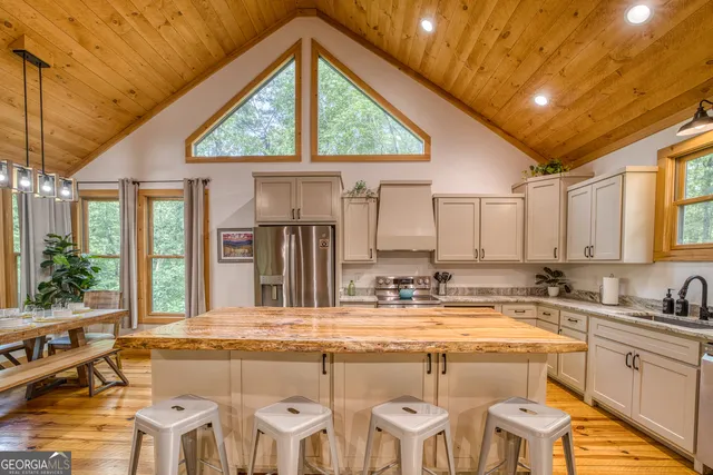 a en suite bathroom with a granite countertop sink and a mirror
