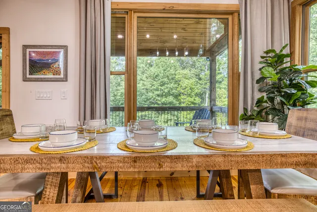 a view of a livingroom with furniture and staircase