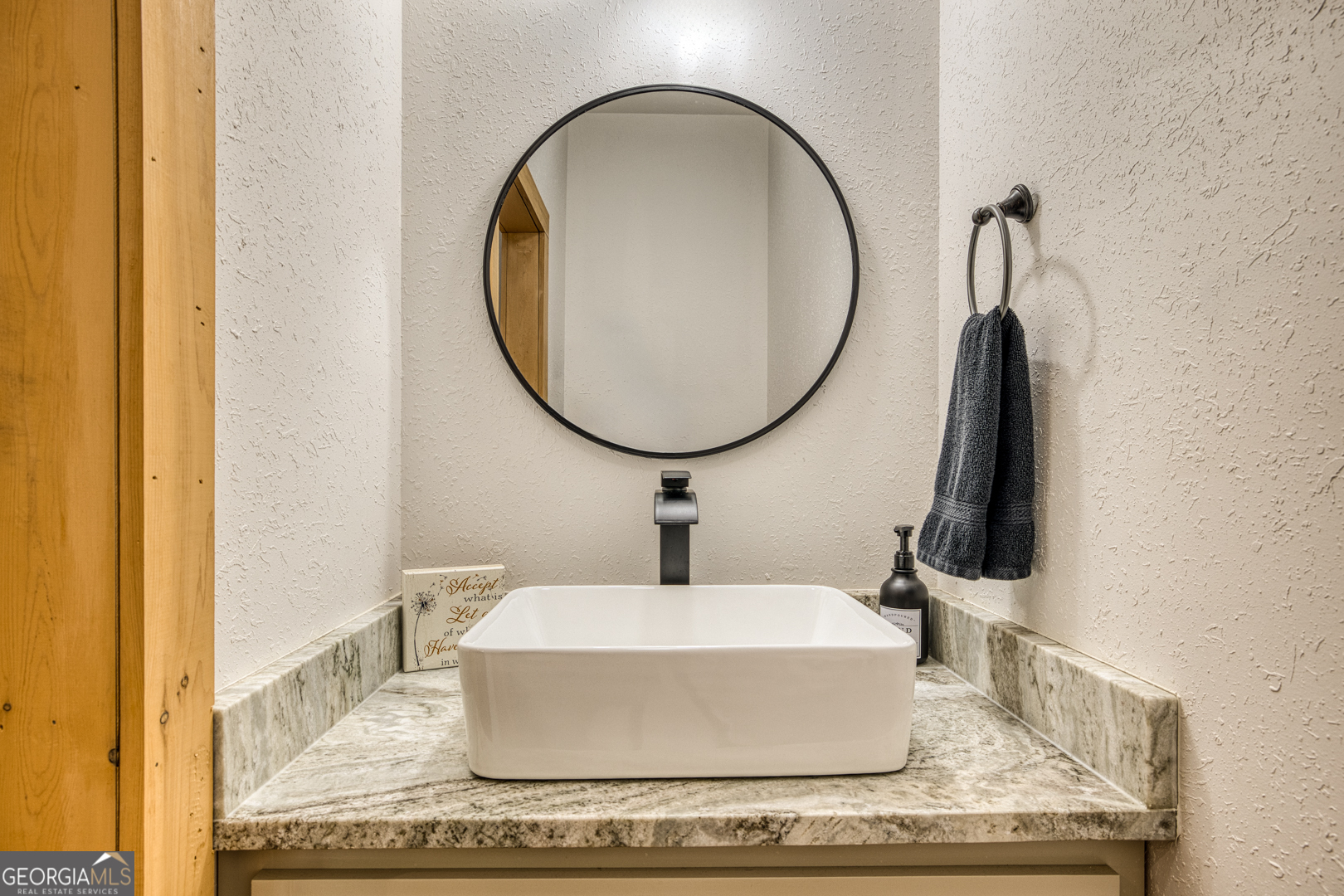 284 Lees Ride McCaysville, GA 30555 - Photo 16 of 104 a bathroom with a sink and a mirror