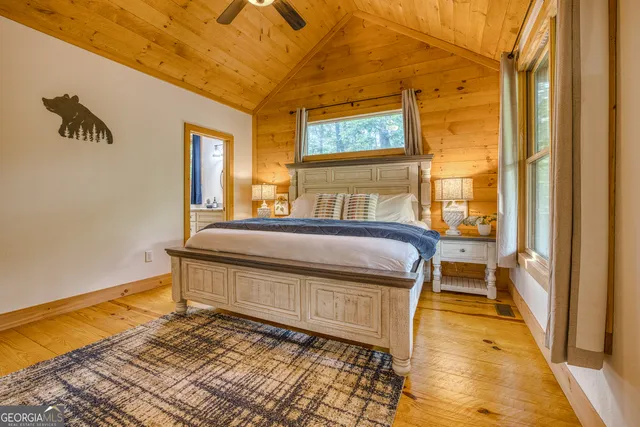 a bathroom with a granite countertop sink a mirror and vanity