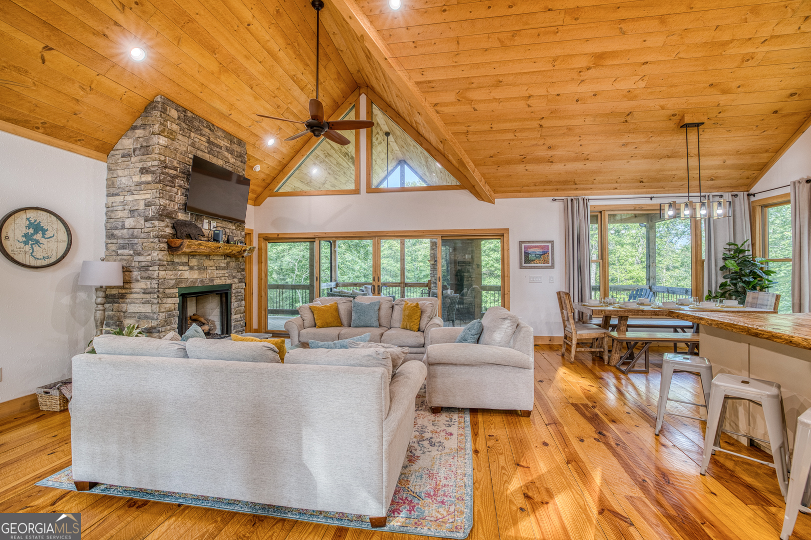 284 Lees Ride McCaysville, GA 30555 - Photo 4 of 104 a living room with fireplace furniture and a large window
