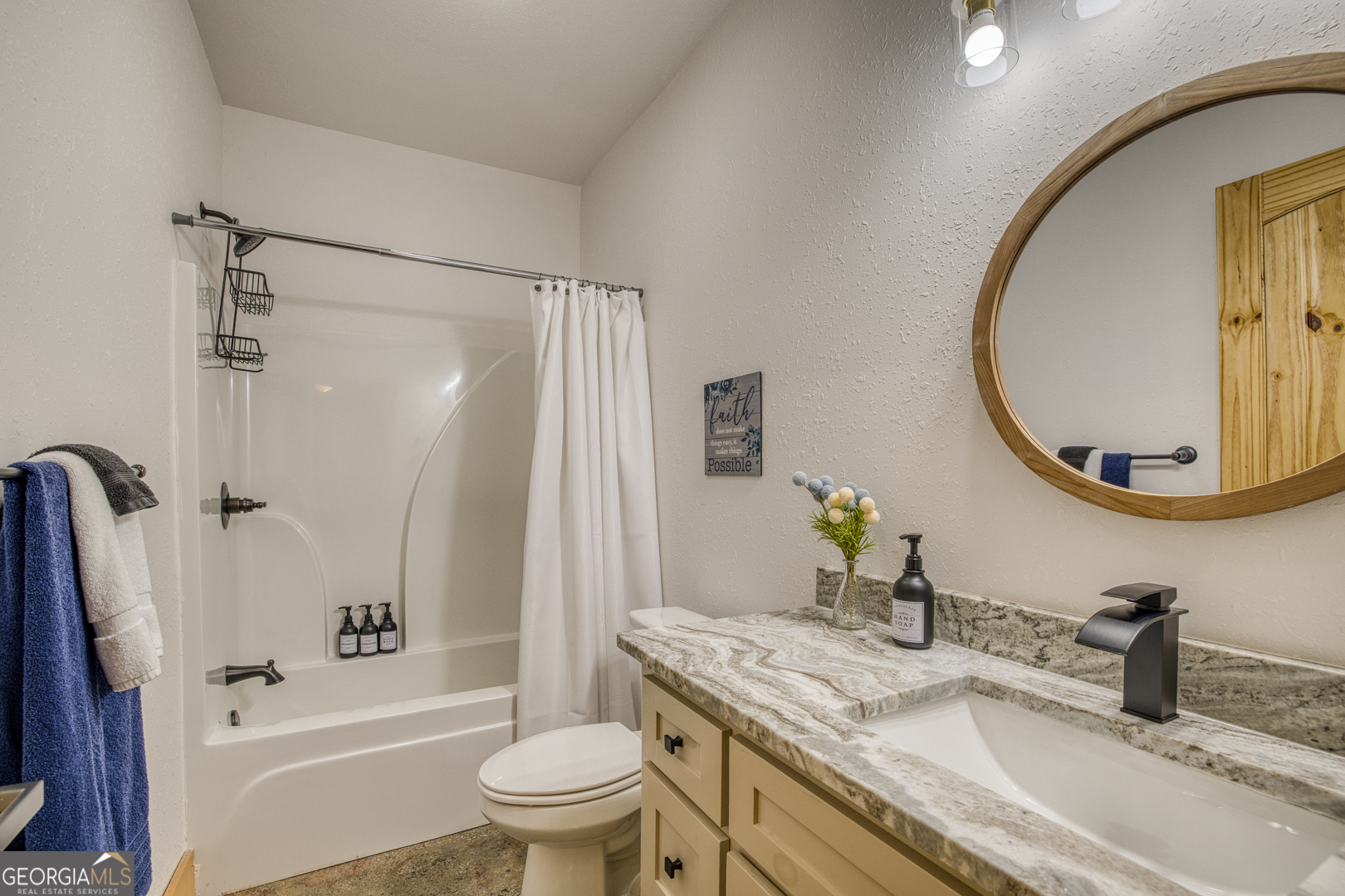 284 Lees Ride McCaysville, GA 30555 - Photo 55 of 104 a bathroom with a granite countertop sink toilet and shower