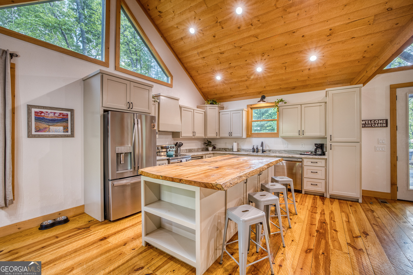 284 Lees Ride McCaysville, GA 30555 - Photo 6 of 104 a kitchen with stainless steel appliances granite countertop a refrigerator and a stove top oven