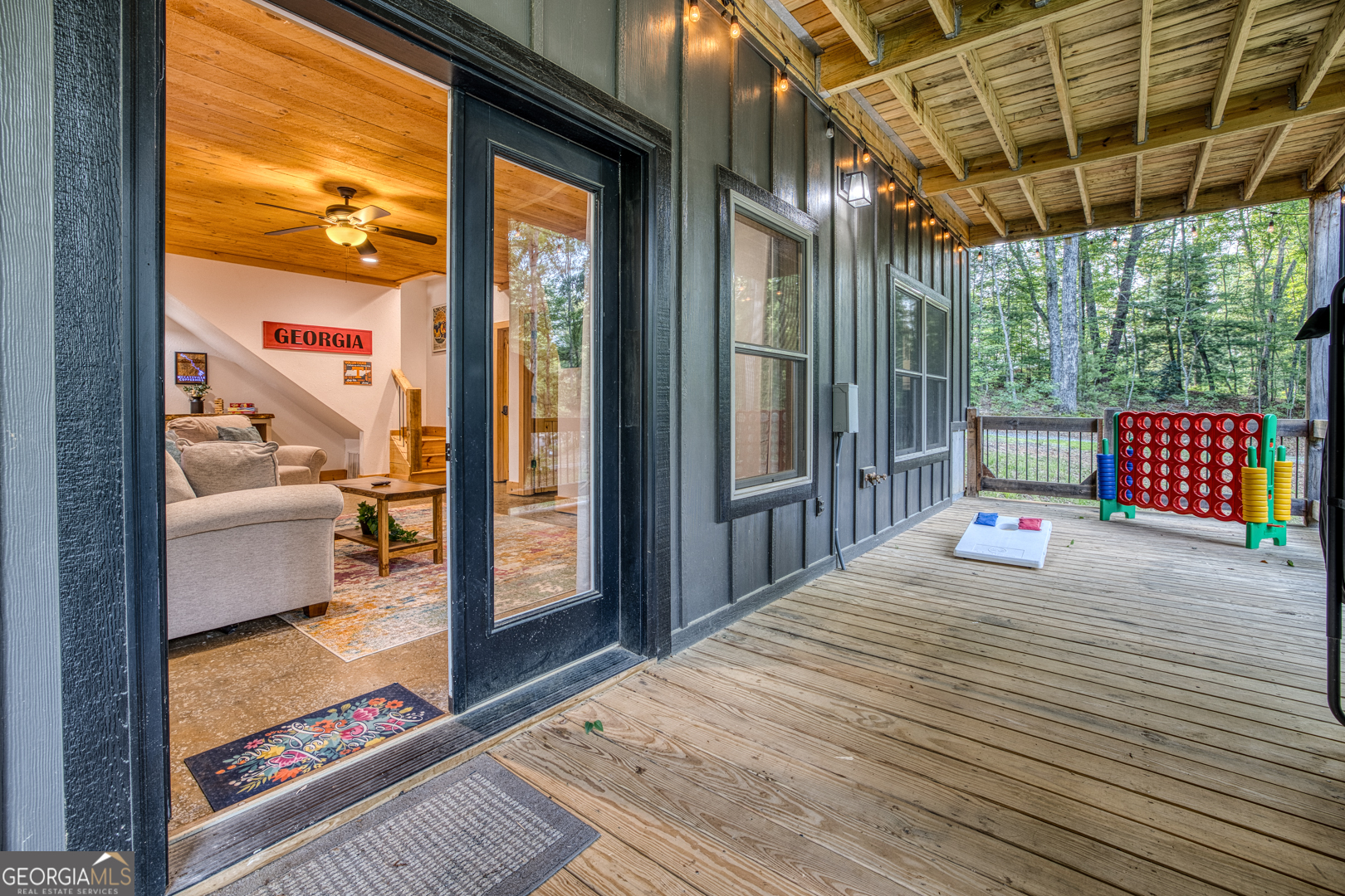 284 Lees Ride McCaysville, GA 30555 - Photo 62 of 104 a bedroom with a bed and wooden floor
