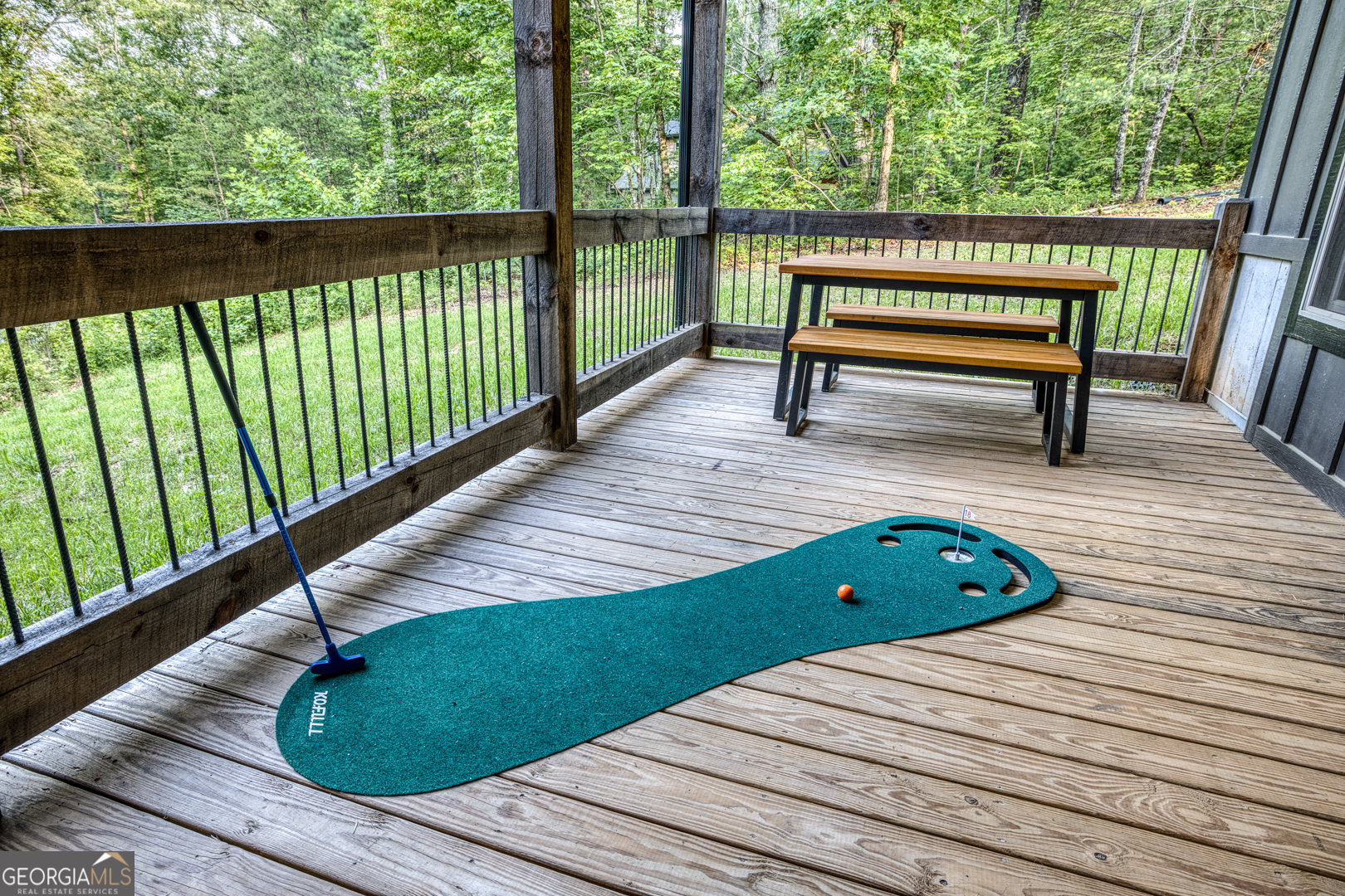 284 Lees Ride McCaysville, GA 30555 - Photo 63 of 104 a view of a wooden deck with a bench