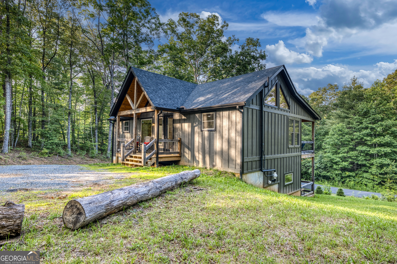284 Lees Ride McCaysville, GA 30555 - Photo 68 of 104 a view of a house with backyard and sitting area