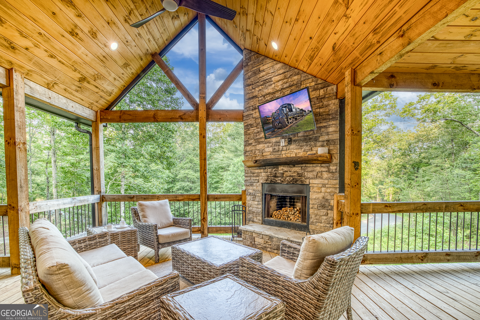 284 Lees Ride McCaysville, GA 30555 - Photo 70 of 104 a living room with furniture a fireplace and a large window