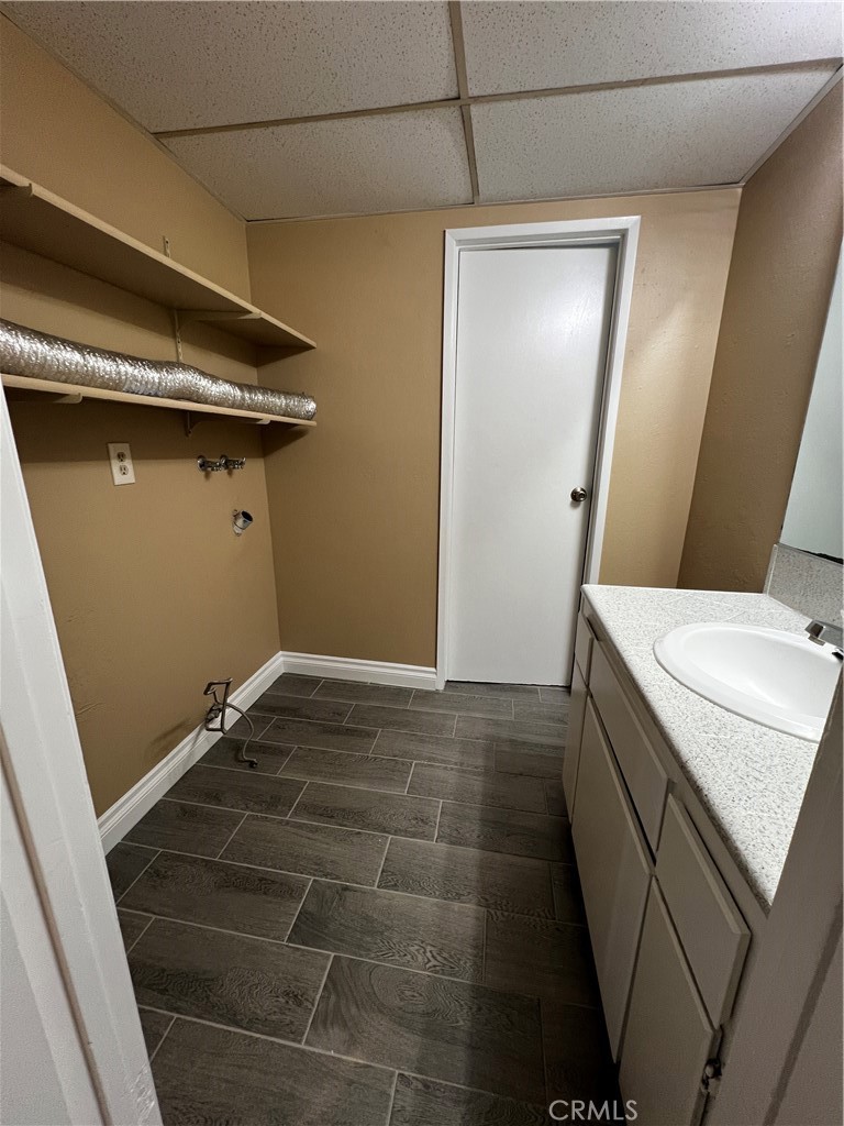1744 Capri Avenue Mentone, CA 92359 - Photo 11 of 24 a bathroom with a sink a toilet and a mirror