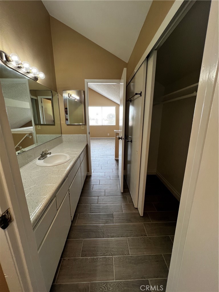 1744 Capri Avenue Mentone, CA 92359 - Photo 15 of 24 a bathroom with sink and mirror