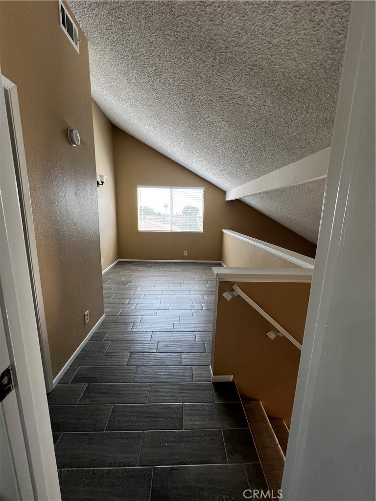 1744 Capri Avenue Mentone, CA 92359 - Photo 16 of 24 a view of an empty room and window