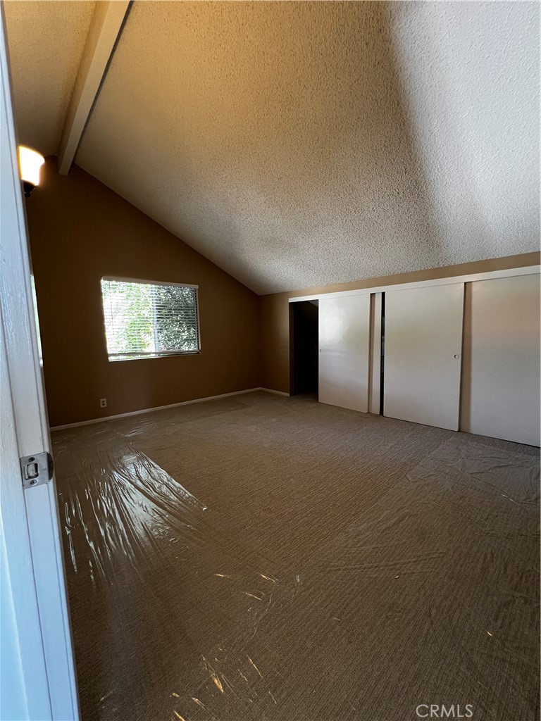 1744 Capri Avenue Mentone, CA 92359 - Photo 18 of 24 a view of an empty room with windows