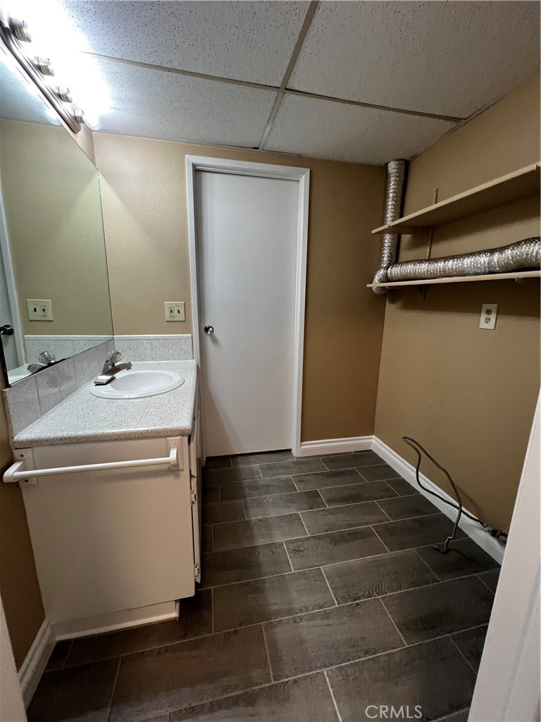 1744 Capri Avenue Mentone, CA 92359 - Photo 9 of 24 a bathroom with a sink and a mirror