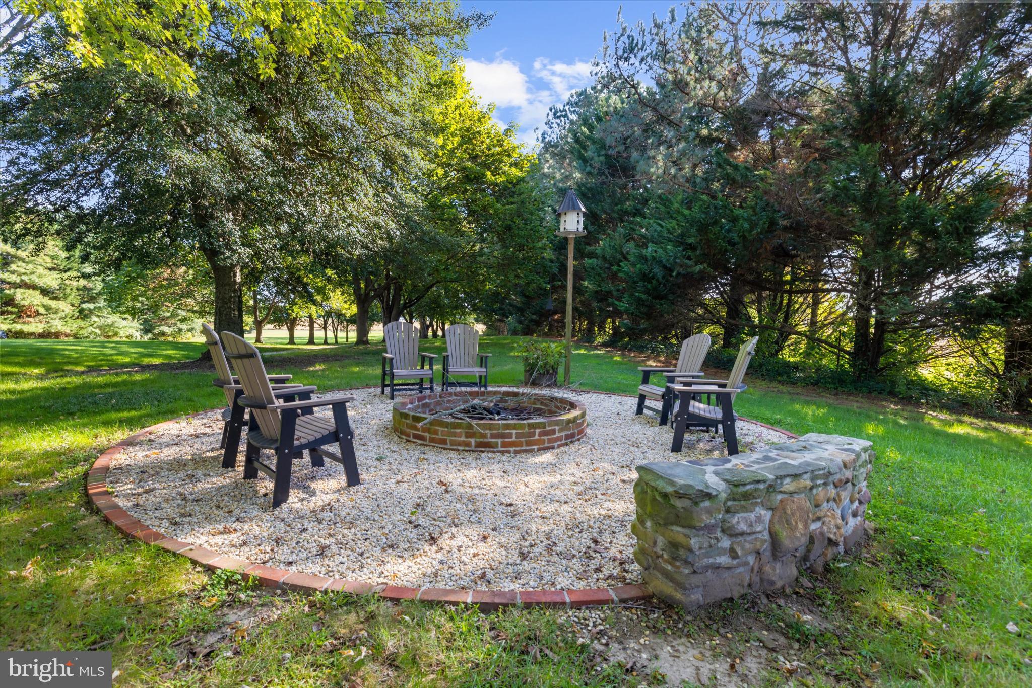 252 Granny Branch Road Church Hill, MD 21623 - Photo 5 of 75 Cozy fire pit surrounded by lush greenery.